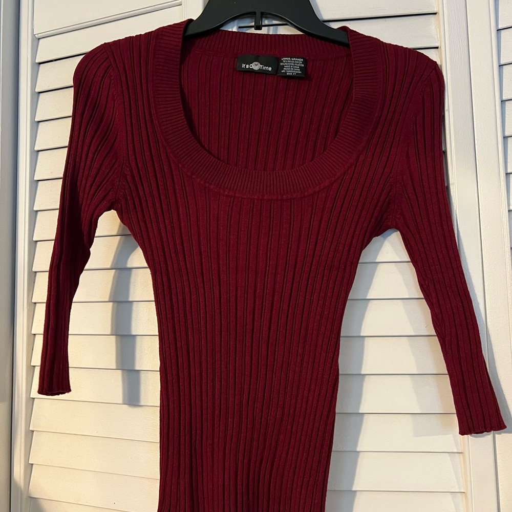 3/4 sleeve fitted sweater.  Size large- fits like a medium